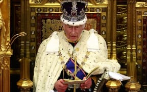 Britain's King Charles III, wearing the Imperial State Crown and the Robe of State, reads the King's Speech from the The Sovereign's Throne in the House of Lords chamber, during the State Opening of Parliament, at the Houses of Parliament, in London, on July 17, 2024.