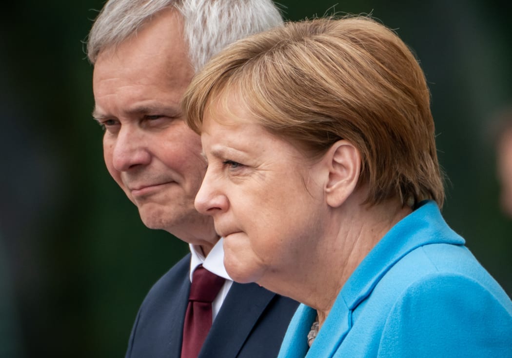 Chancellor Angela Merkel receives Finland's new Prime Minister Antti Rinne with military honours before the Federal Chancellery.