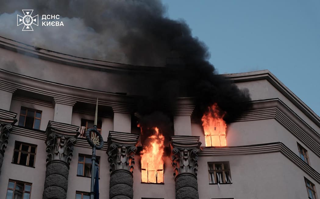 This handout photograph taken and released by Ukrainian State Emergency Service on September 7, 2025, shows a fire at the Ukrainian government building in Kyiv, following an overnight attack, amid the Russian invasion of Ukraine. Russia fired its biggest-ever aerial barrage at Ukraine early on September 7, setting the seat of the Ukrainian government in Kyiv ablaze, authorities said. (Photo by Handout / Ukrainian State Emergency Service / AFP) / RESTRICTED TO EDITORIAL USE - MANDATORY CREDIT "AFP PHOTO /  UKRAINIAN STATE EMERGENCY SERVICE " - HANDOUT - NO MARKETING NO ADVERTISING CAMPAIGNS - DISTRIBUTED AS A SERVICE TO CLIENTS