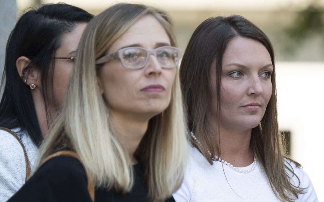 Alleged victims  Annie Farmer (L) and  Courtney Wild (R) leave the courthouse after of a bail hearing in US financier Jeffrey Epstein's sex trafficking case on July 15, 2019 in New York City. -