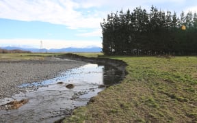 the Ashburton River is virtually running through the back of the Stewarts' family farm after May 2021 flooding