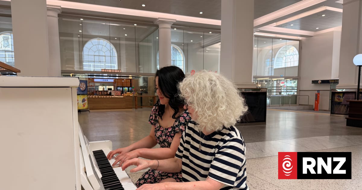 A public piano brings a moment's pause to a bustling train station