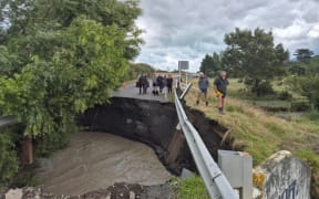 A large hole has opened up at the Lake Ferry Road bridge cutting off communities in South Wairarapa.