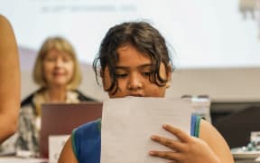 Nine-year-old Monica Lesa calls on adults to do better at a children's rights workshop in Samoa.