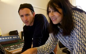 Lord Echo, aka Mike Fabulous, and Yadana Saw listen to the album Harmonies.