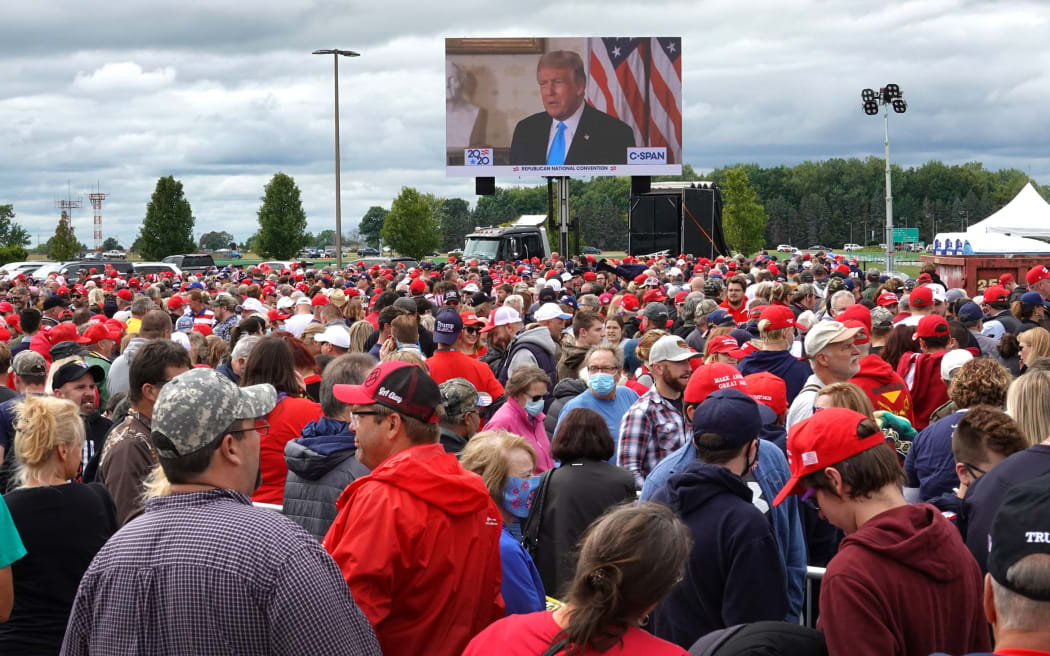 FREELAND, MICHIGAN - SEPTEMBER 10: Supporters wait in line to enter a rally with President Donald Trump on September 10, 2020 in Freeland, Michigan.