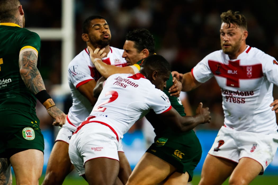 Australia's Billy Slater is tackled by England's Kallum Watkins and Jermaine McGillvary.