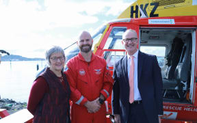 Land Information Minister Eugenie Sage and Transport Minister Phil Twyford with rescue helicopter pilot, Rob Arrowsmith.