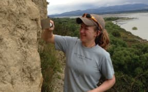 Bess Koffman prepares to collect a sample from the Barr Hill loess deposit, near the Rakaia River
