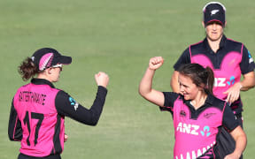 New Zealand's Amy Satterthwaite and Amelia Kerr celebrate after Kerr takes a wicket.