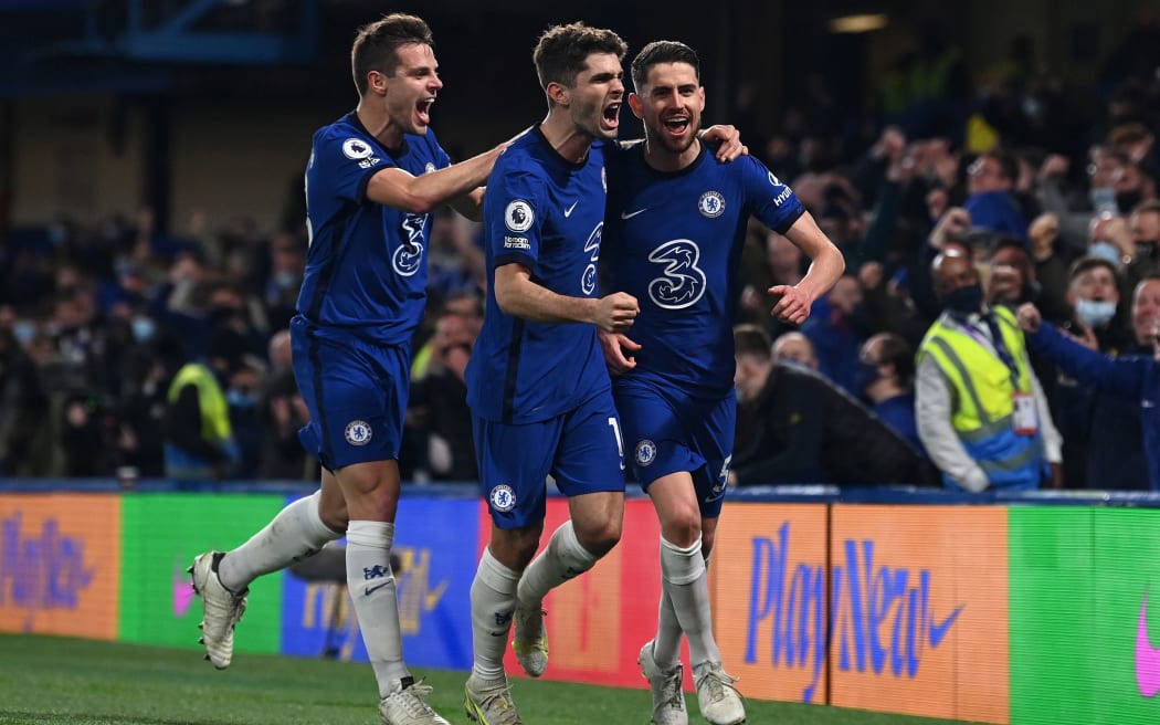 Chelsea's Italian midfielder Jorginho (R) celebrates scoring his team's second goal during the English Premier League football match between Chelsea and Leicester City at Stamford Bridge in London on May 18, 2021.