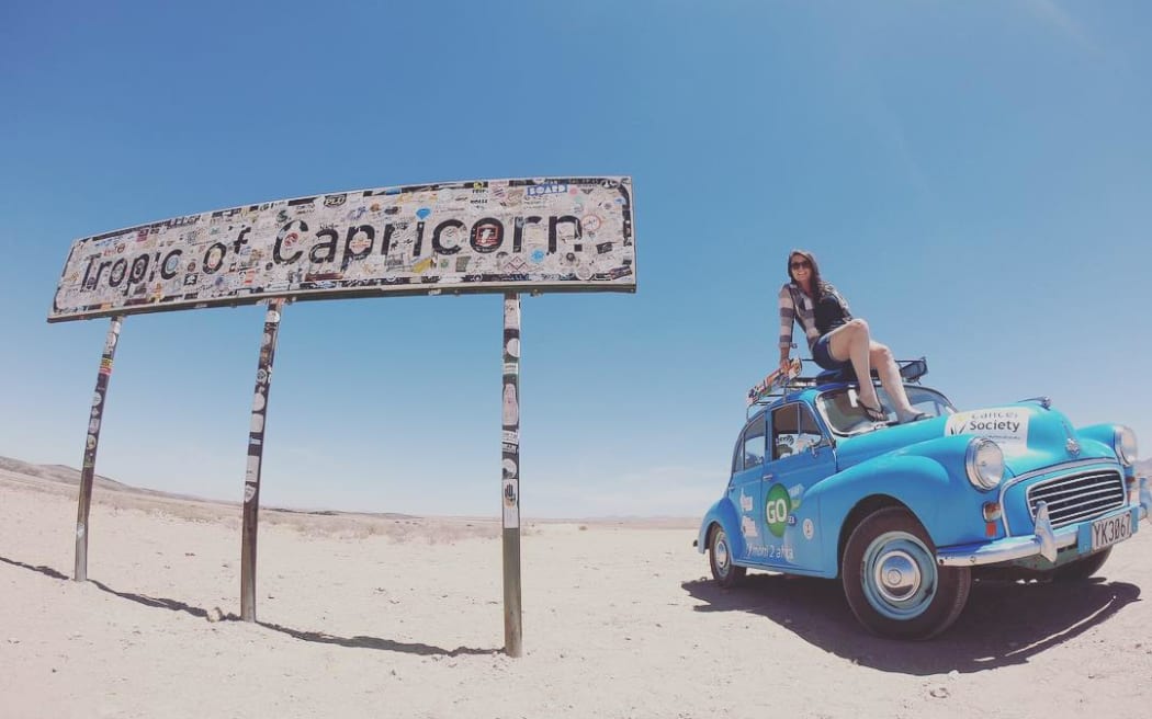 Laura Morrison and her 1958 Morris Minor 1000 which she drove from Aberdeen to Cape Town.