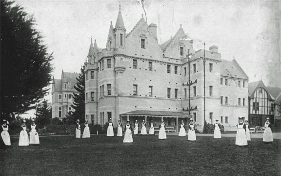 Nurses on front lawn of Seacliff Lunatic Asylum, 1890.