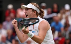 New Zealand's Lulu Sun celebrates winning against Britain's Emma Raducanu during their women's singles fourth round tennis match on the seventh day of the 2024 Wimbledon Championships at The All England Lawn Tennis and Croquet Club in Wimbledon, southwest London, on July 7, 2024. Sun won the match 6-2, 5-7, 6-2.