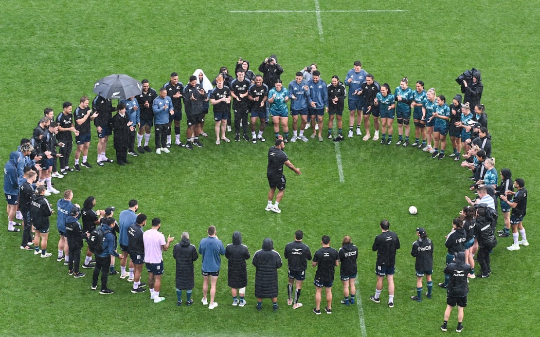 George Bower does a dance as the All Blacks and Black Ferns players gather in the middle of Eden Park during their captain's run at Eden Park in Auckland ahead of tomorrow's Bledisloe Cup, Rugby Championship test match and Black Ferns match against Japan. Auckland, New Zealand. Friday 23 September 2022. © Photo : Andrew Cornaga / www.photosport.co.nz
