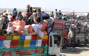 Afghan refugees arrive in trucks and cars to cross the Pakistan-Afghanistan border in Chaman on 31 October, 2023. More than 10,000 Afghans living in Pakistan rushed to the borders, just hours before a deadline for 1.7 million people to leave Pakistan voluntarily or face arrest and deportation.