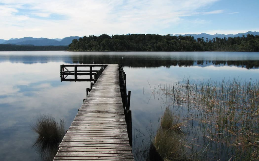 Department of Conservation/SUPPLIED
Lake Māhinapua at Shanghai Bay Jetty. Mana whenua in the area have reminded the Te Tai o Poutini Plan committee of the sacred (tapu) status of the picturesque lake.