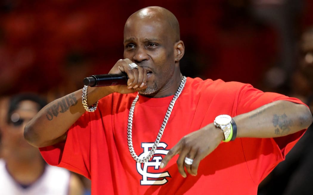 (FILES) In this file photo taken on July 23, 2017 rapper DMX performs during week five of the BIG3 three on three basketball league at UIC Pavilion in Chicago, Illinois.