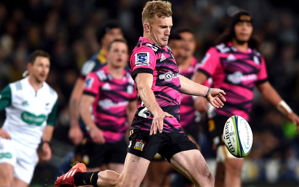 Damian McKenzie of the Chiefs, unleashes a kick during the Super Rugby Aotearoa match between the Highlanders and the Chiefs in Dunedin.