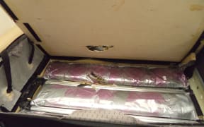 Three people have been arrested for trying to smuggle up to $5m of MDMA through Auckland Airport.