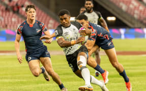 Fiji's Nacani Boginisoko runs through the Great Britain defense to score for Fiji at the Singapore 7s tournament on Saturday, January 31, 2026. Fiji won 22-19. Photo: World Rugby