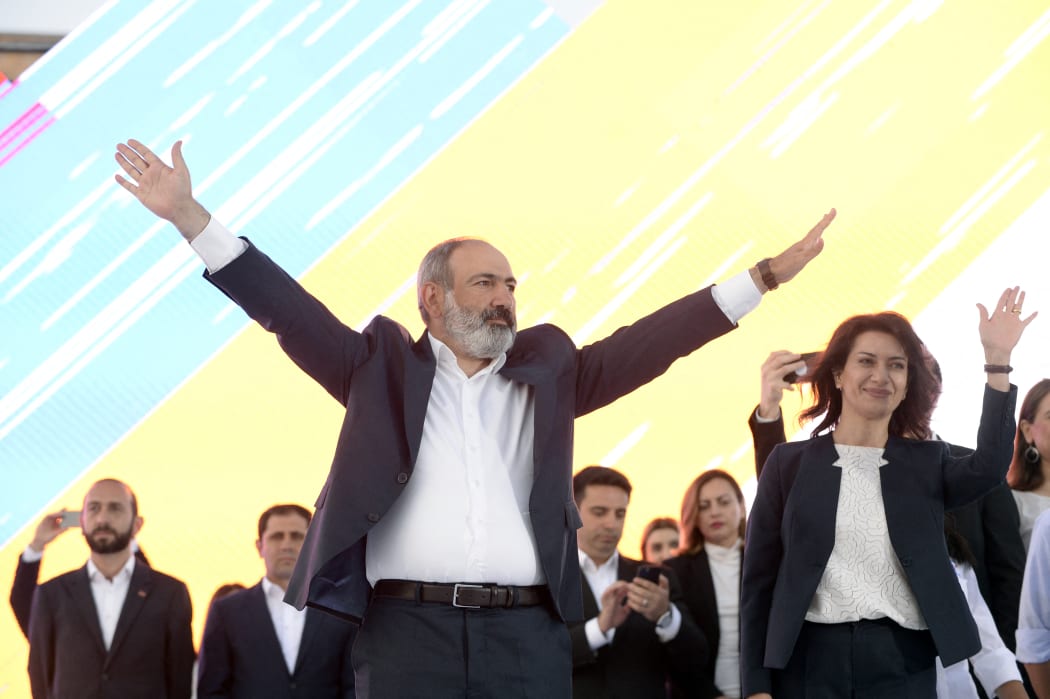 Armenia's acting prime minister, Nikol Pashinyan, waves on stage during a campaign rally in central Yerevan, on June 17, 2021.
