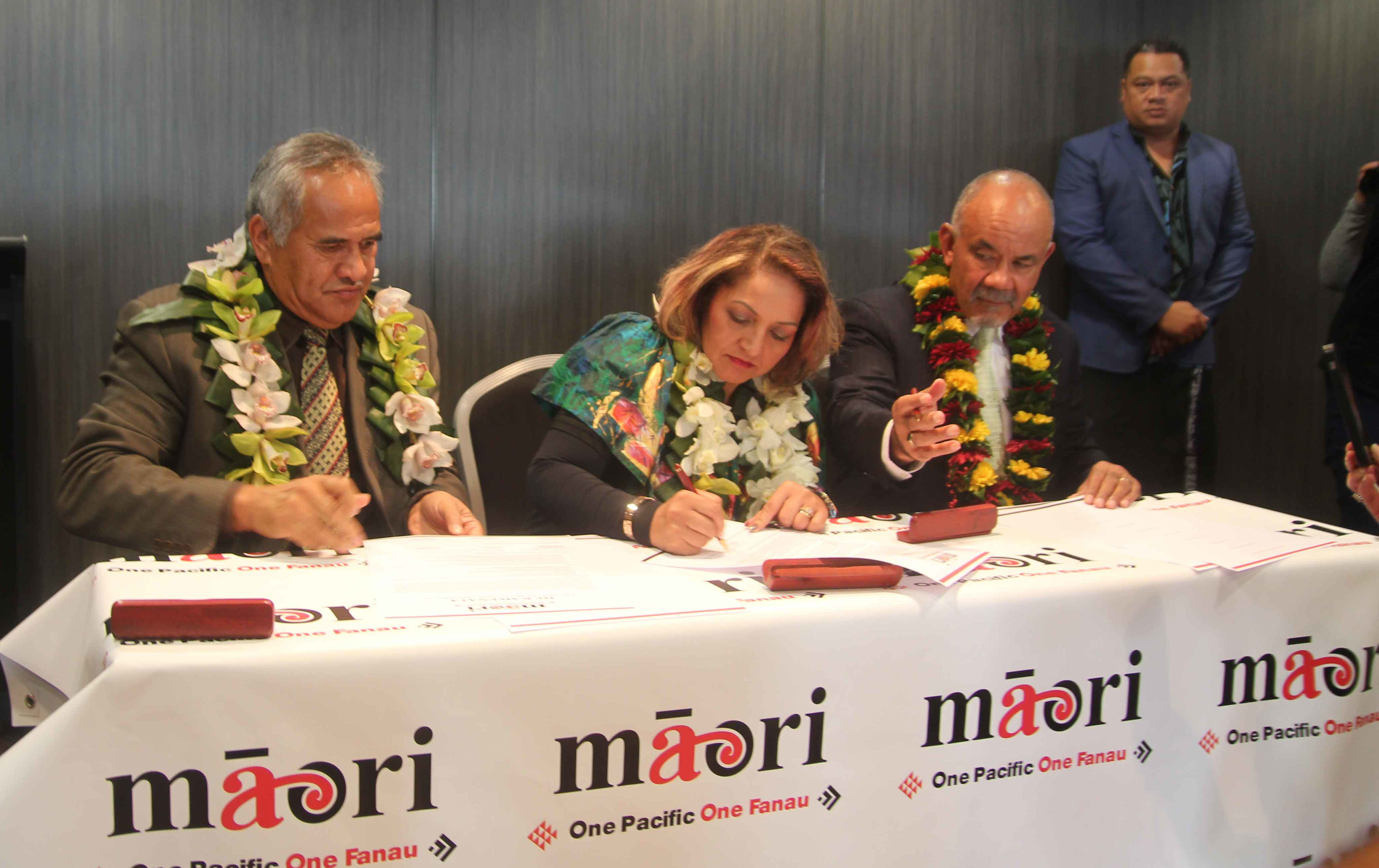 The signing of a partnership between the Maori Party and One Pacific.