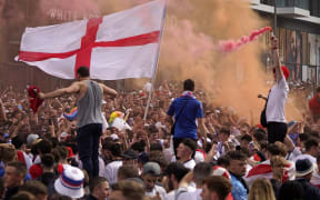 England fans cheer on their team outside Wembley Stadium ahead of the UEFA EURO 2020 final football match between England and Italy