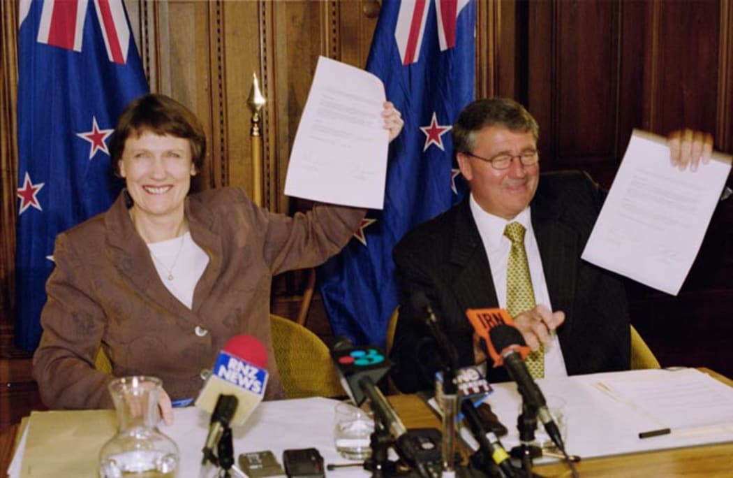 Labour leader and Prime Minister Helen Clark and Jim Anderton, leader of the coalition partner the Alliance, hold up their coalition agreement in 1999.