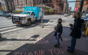 Thank you messages are written on the sidewalk outside of Mt. Sinai West Medical Center on April 7, 2020 in New York.