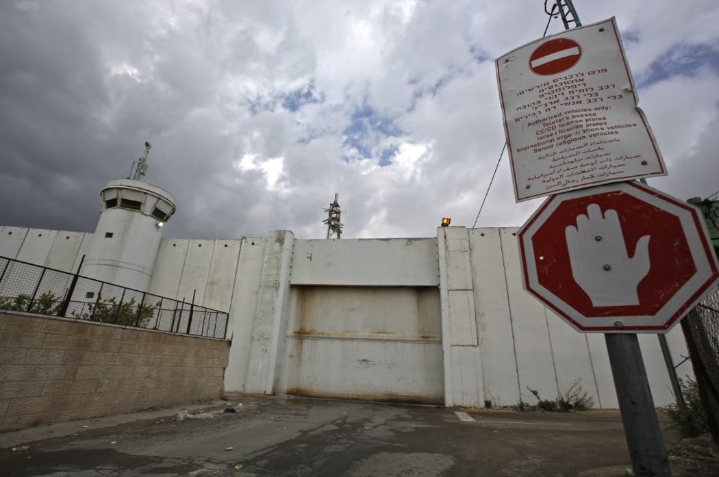 The crossing gate between the Israeli occupied West Bank city of Bethlehem and Jerusalem remains closed on March 6, 2020, following a lockdown on the biblical city, after the first Palestinian cases of the deadly coronavirus were discovered there.