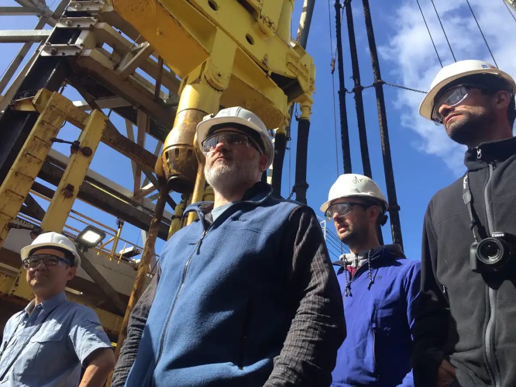 Sanny Saito (Japan), Rupert Sutherland (New Zealand), Thomas Westerhold (Germany), and Edo Dallanave (Italy) on the drill floor of the JOIDES Resolution during an expedition to drill into the hidden continent Zealandia.