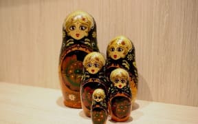 Five Russian matryoshka dolls.