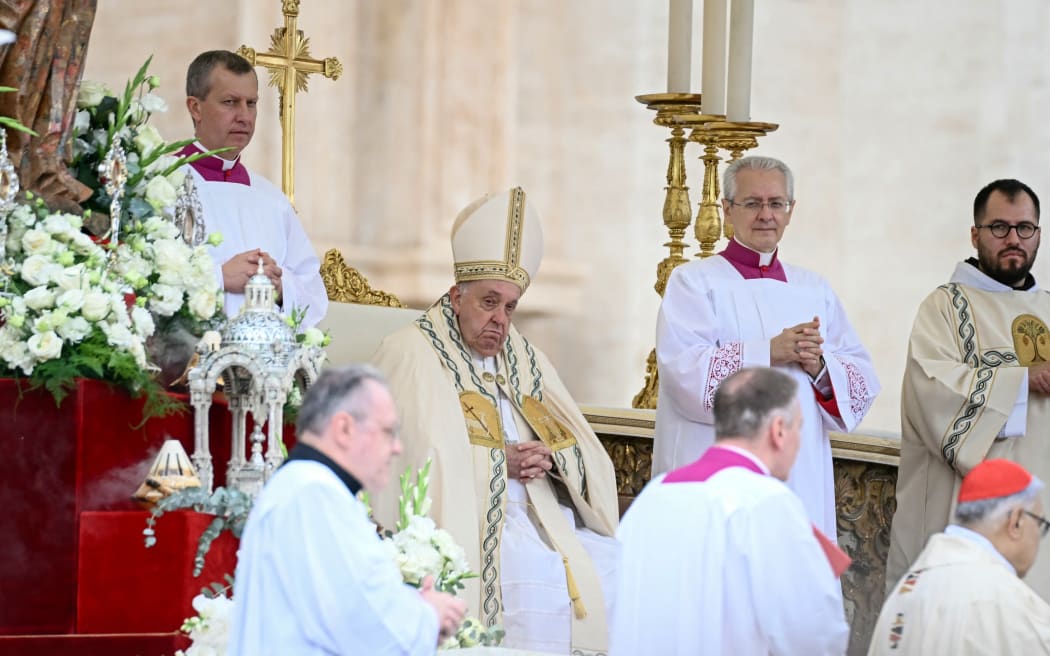 Pope Francis (C) presides the Holy Mass and canonisation of 14 saints and martyrs from Damascus, at the Saint Peter's Square in the Vatican on October 20, 2024. (Photo by Filippo MONTEFORTE / AFP)