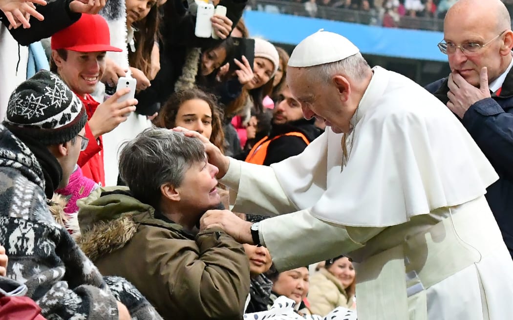 Pope Francis greets a handicapped wellwisher as he arrives at the Swedenbank Stadion in Malmo, Sweden, where he is to hold a mass on November 1, 2016.