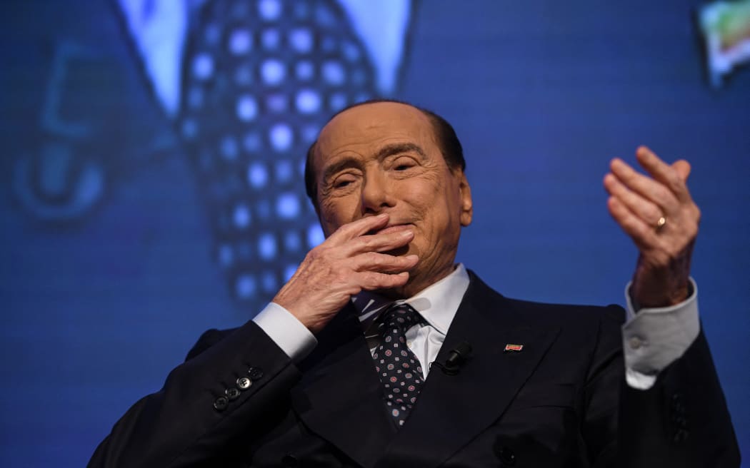 Silvio Berlusconi, leader of Forza Italia party, gestures on stage during the electoral campaign ahead of general elections in Milan, Italy on 23 September 2022.
