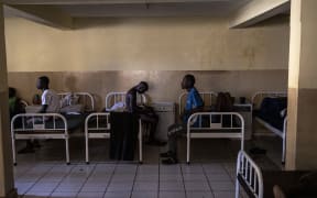 Recovering Kush addicts sit on their beds at the Kissy Mental Hospital in Freetown on 22 June, 2023.