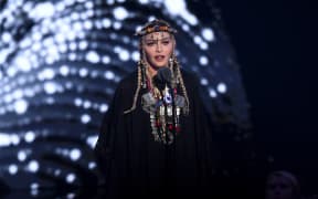 Madonna speaks onstage during the 2018 MTV Video Music Awards