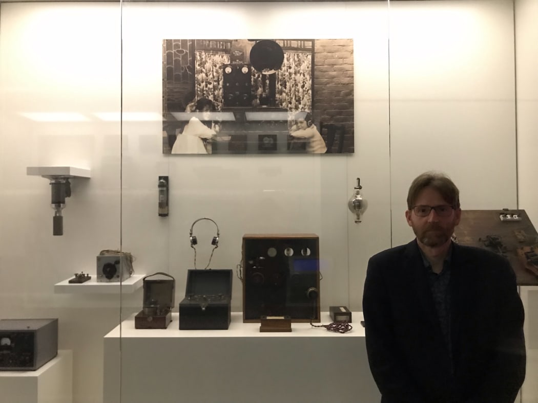 Tōitu Otago Settlers Museum curator Pete Read in front of the early radio display.