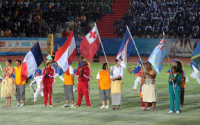 Athletes pose with their delegations' respective flags during the Opening Ceremony for the 14th Pacific Games, in 2011, in New-Caledonia.