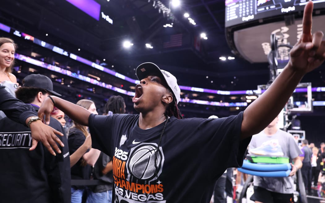 Chelsea Gray of the Las Vegas Aces celebrates with fans after winning Game Four of the WNBA playoffs against the Phoenix Mercury.