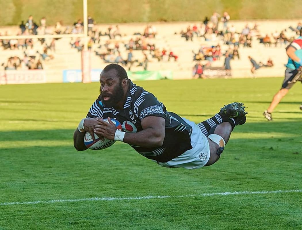 Peni Ravai scores a try off the bench against Spain.