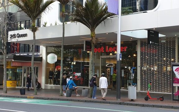 Young people waiting for Foot Locker Queen Street to open.