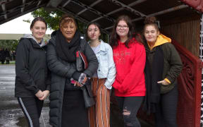 Phillipa Hakopa and rangitahi outside Tūrangawaewae Marae for the Koroneihana.