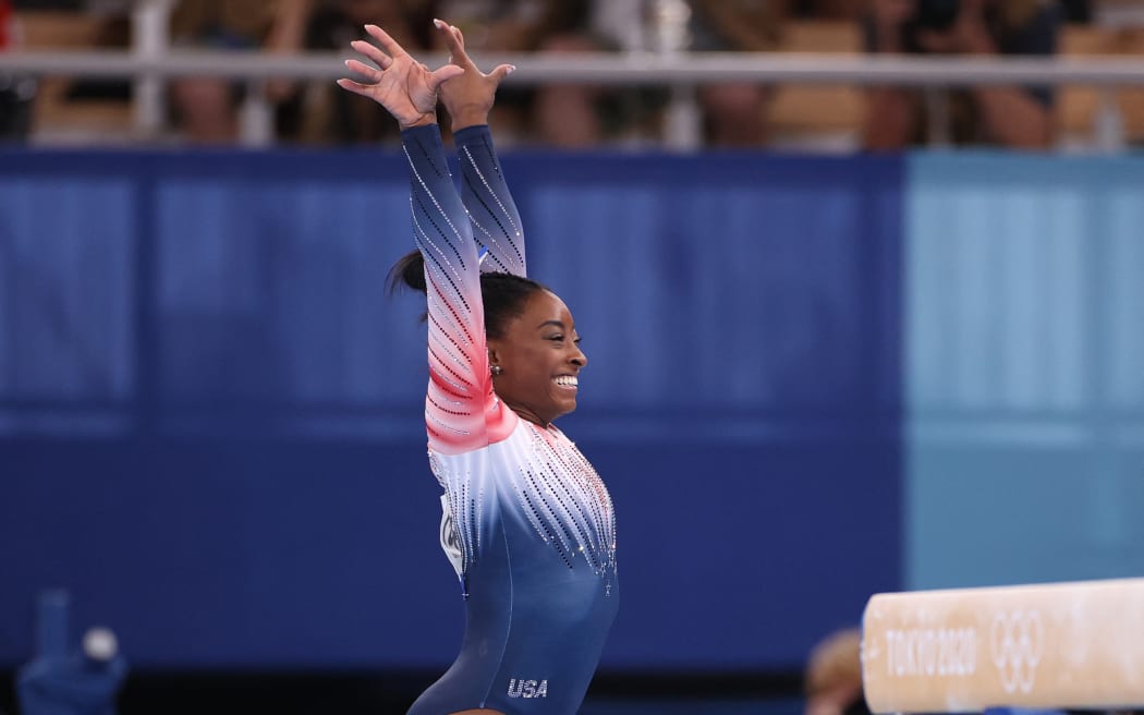 Simone Biles of United States reacts after performing artistic gymnastics womens balance beam final at Ariake Gymnastics Center in Koto Ward, Tokyo 3 August.