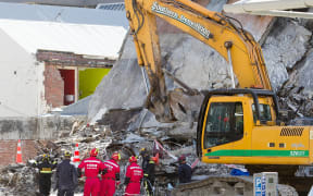 Urban Search and Rescue teams from New Zealand and China work on the wreckage of the CTV building.