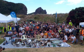 The Sustainable Coastline group and volunteers who helped with cleaning up West Auckland beaches and some of what they found.