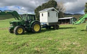 Paeroa farmer Bart Van de Ven moving has also had to move his daughters' playhouse.