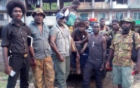 Gerald Turumanu with former combatants.