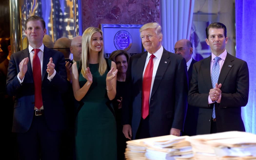 (FILES) In this file photo taken on January 11, 2017, US President-elect Donald Trump along with his children Eric (L), Ivanka and Donald Jr., arrive for a press conference January 11, 2017 at Trump Tower in New York.
